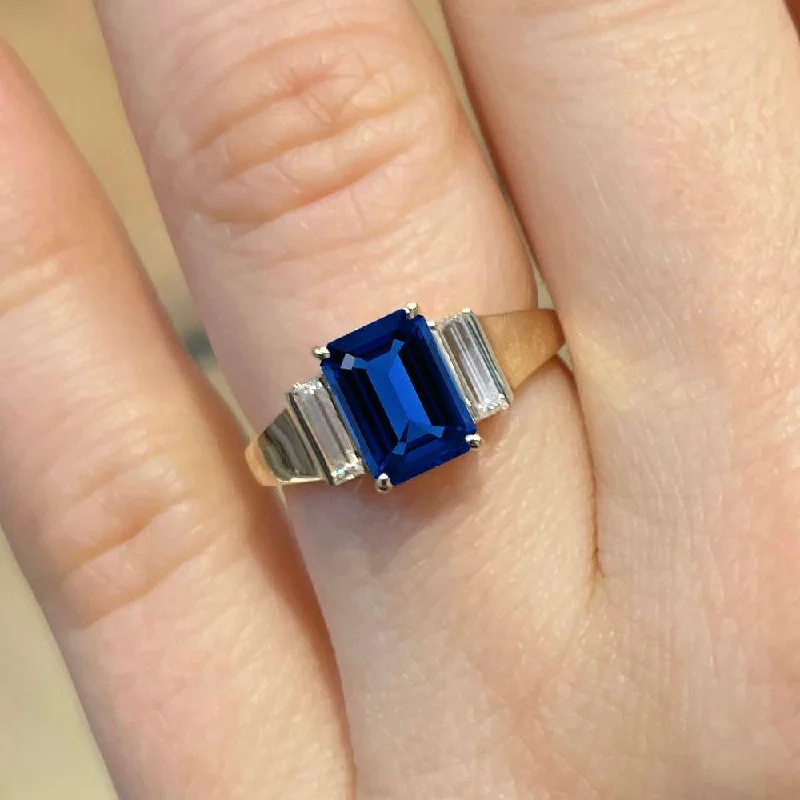 2.50 Carat Emerald Shape Three Stone Blue Sapphire Engagement Ring